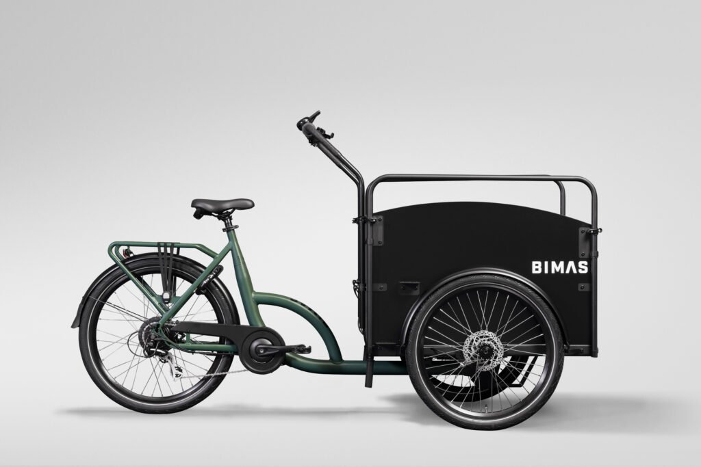 Grön trehjulig Bimas lådcykel med stor frontlåda