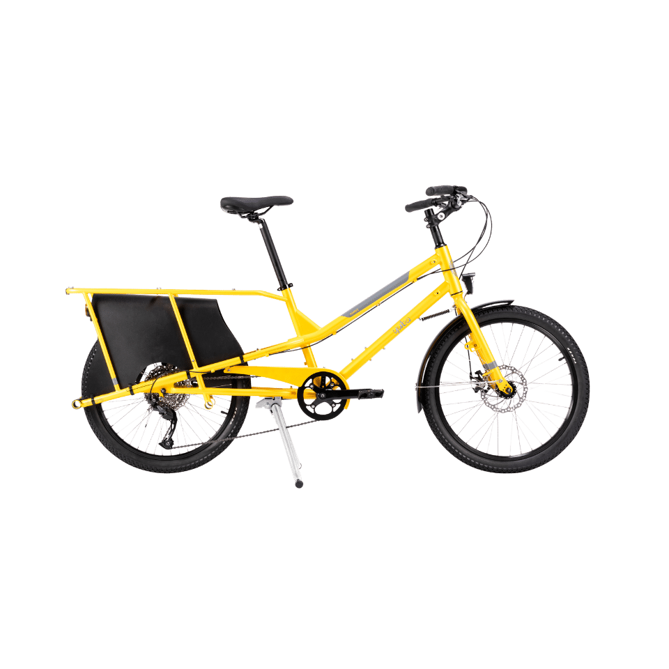 En gul Yuba Kombi-lastcykel med ett långt bakre pakethållare, svart sadel och svart styre visas mot en enfärgad vit bakgrund – en praktisk elfri longtail-lösning för transport av tunga laster.